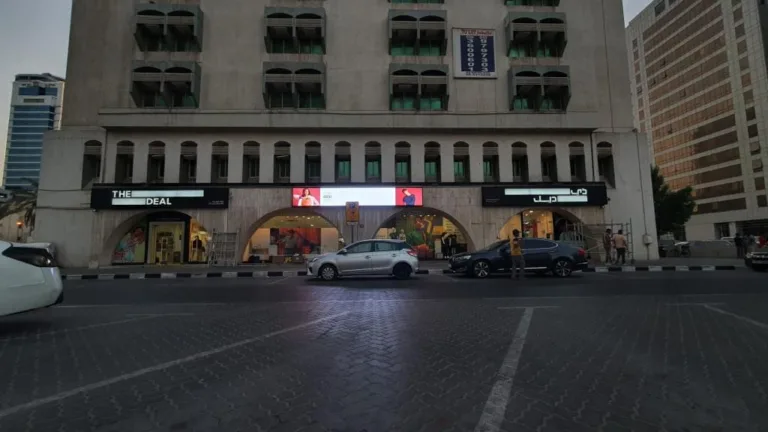 Three outdoor LED display boards for store showing vibrant visuals