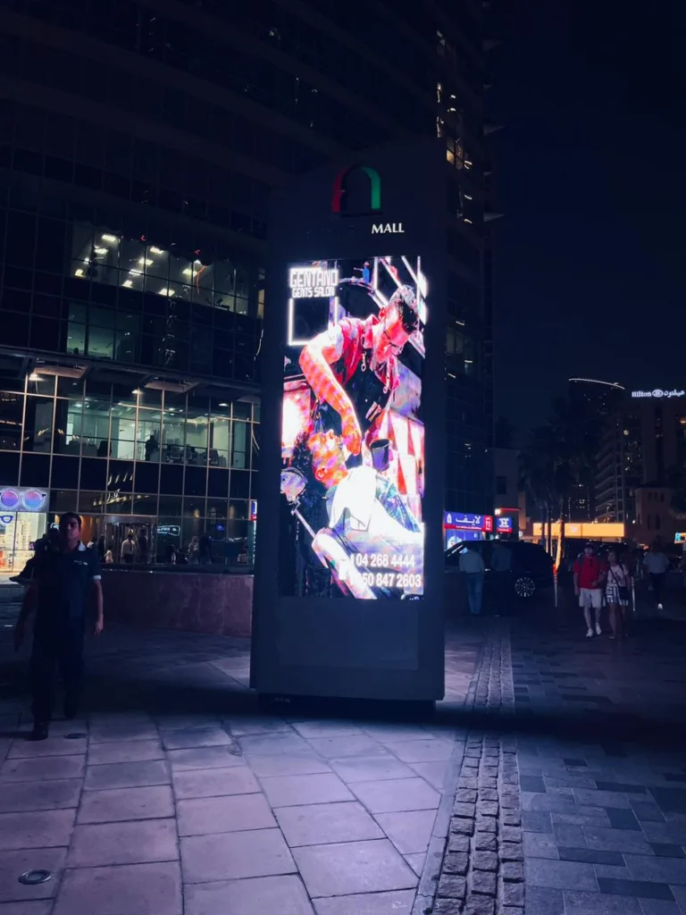 Outdoor LED screen glowing brightly at night