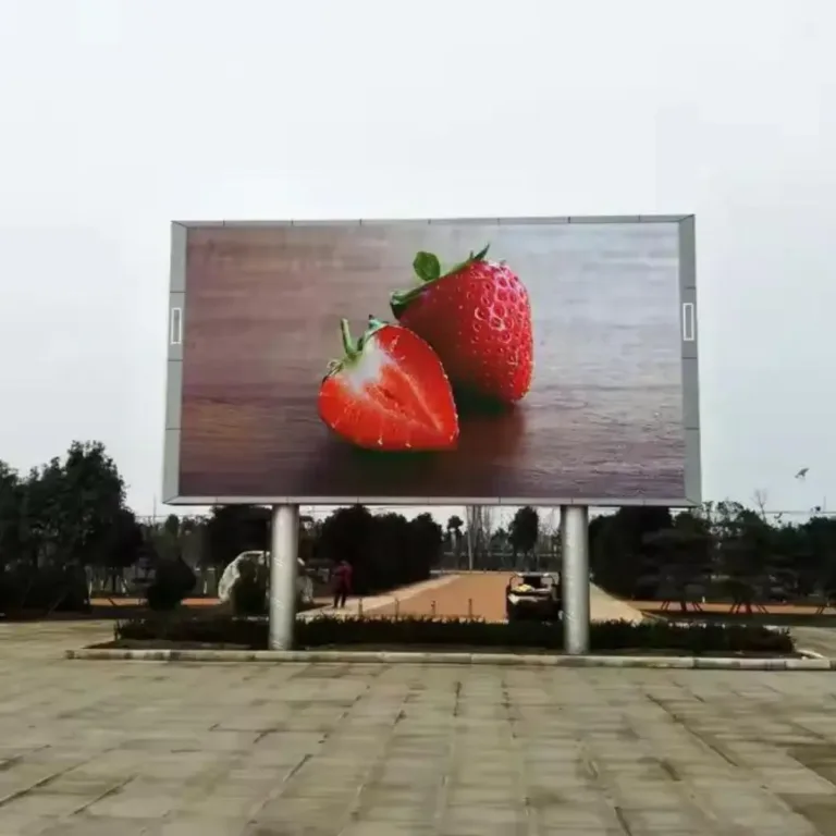 Outdoor LED screen displaying colorful strawberry arrangement
