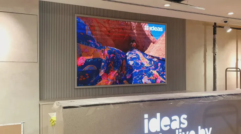 Indoor LED screen mounted on wall displaying vibrant content