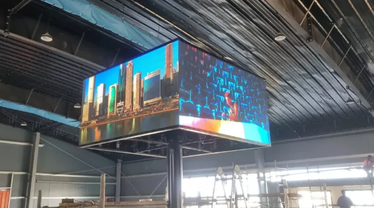 4-sided hanging LED display showing city skyline