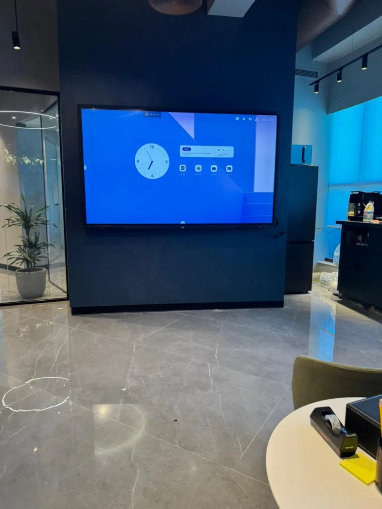 Interactive LCD screen in modern furnished room interior