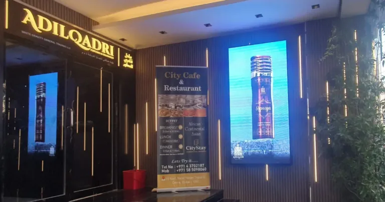 Hotel entrance with outdoor LED screen on wall