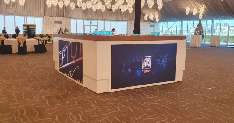 Three indoor P2.5 LED displays showing brand advertisements