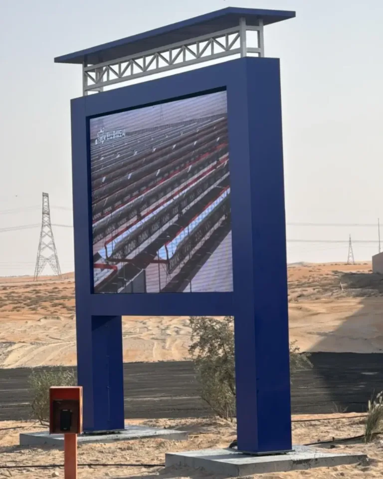 Outdoor LED display screen standing in desert showing vibrant visuals