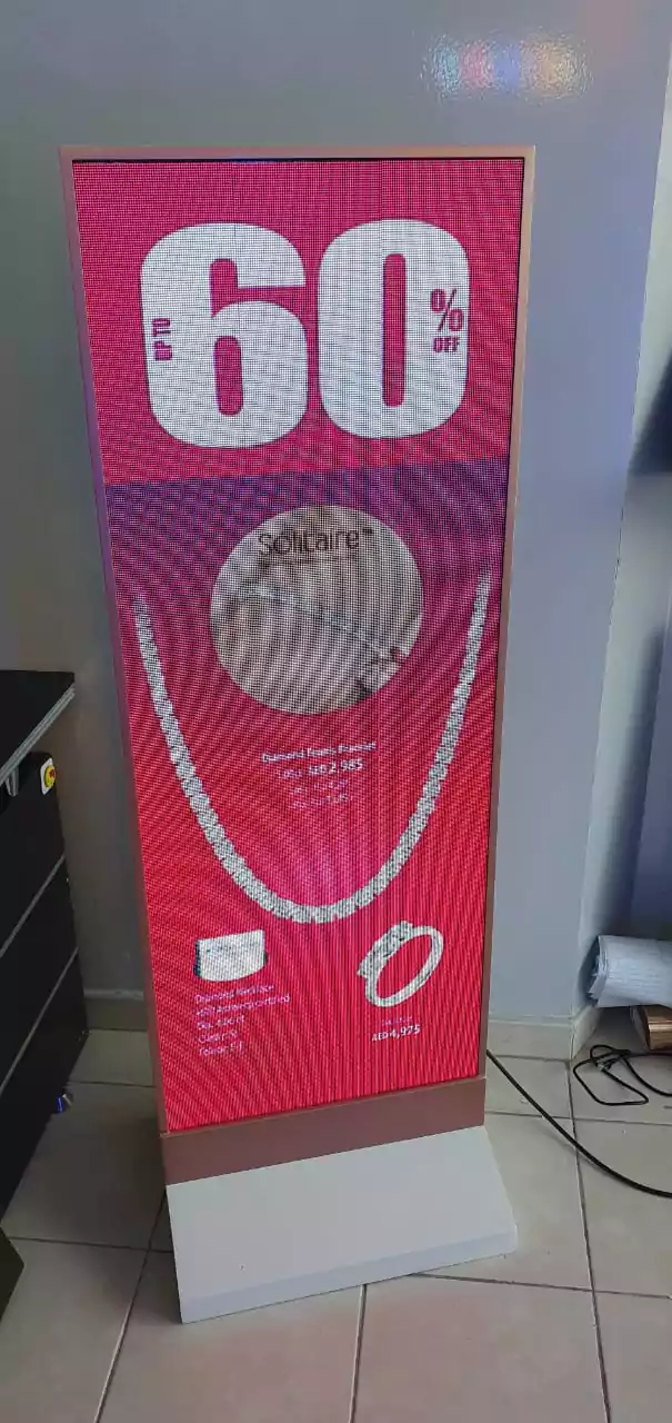 Diamond necklace showcased on display kiosk