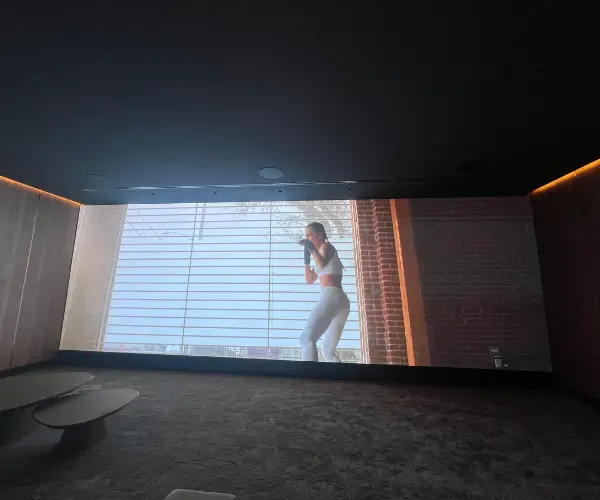 indoor advertising led display screen showing showing a female boxing video
