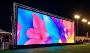 Outdoor rental LED screen showing a colorful floral display