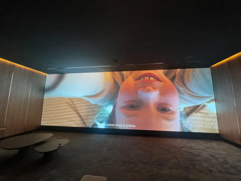 Indoor LED screen displays child's smiling face