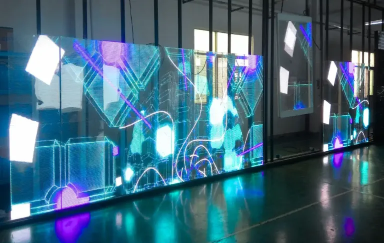 Transparent LED display screen showing colorful light array inside building