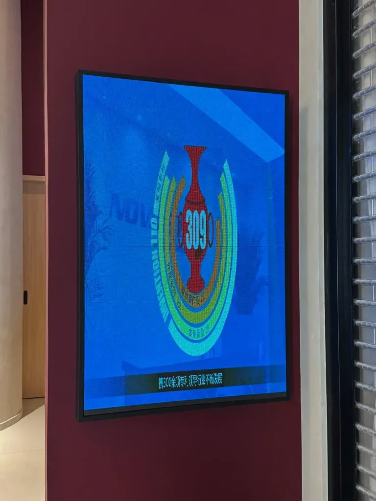 Indoor LED screen mounted on wall displaying an image