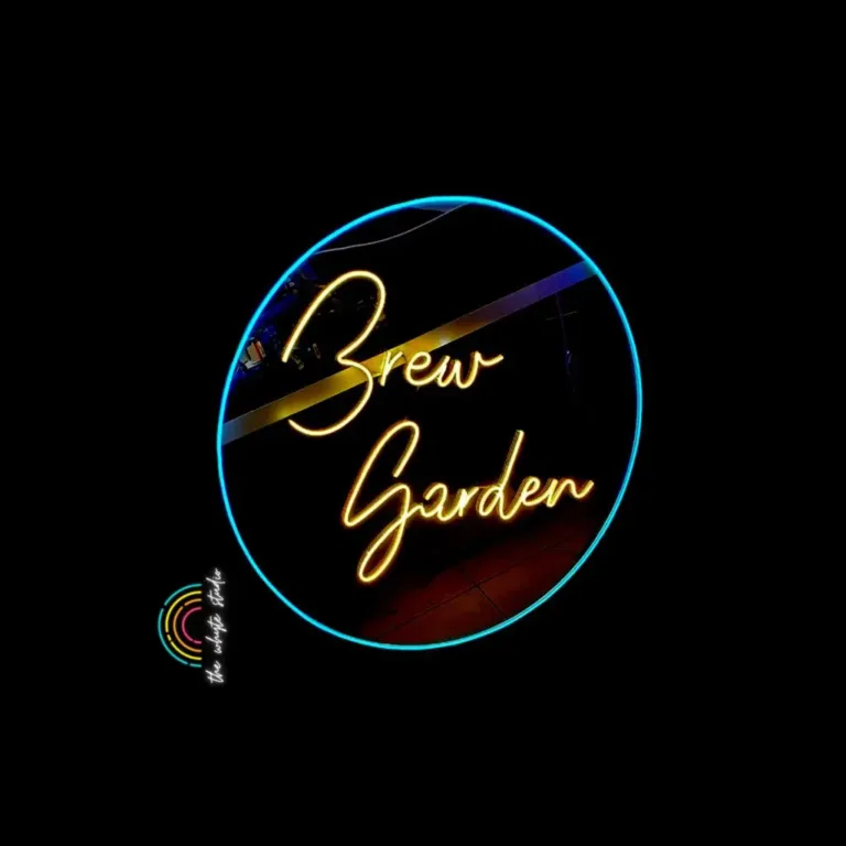 Neon sign reading 'Brew Garden' against dark background