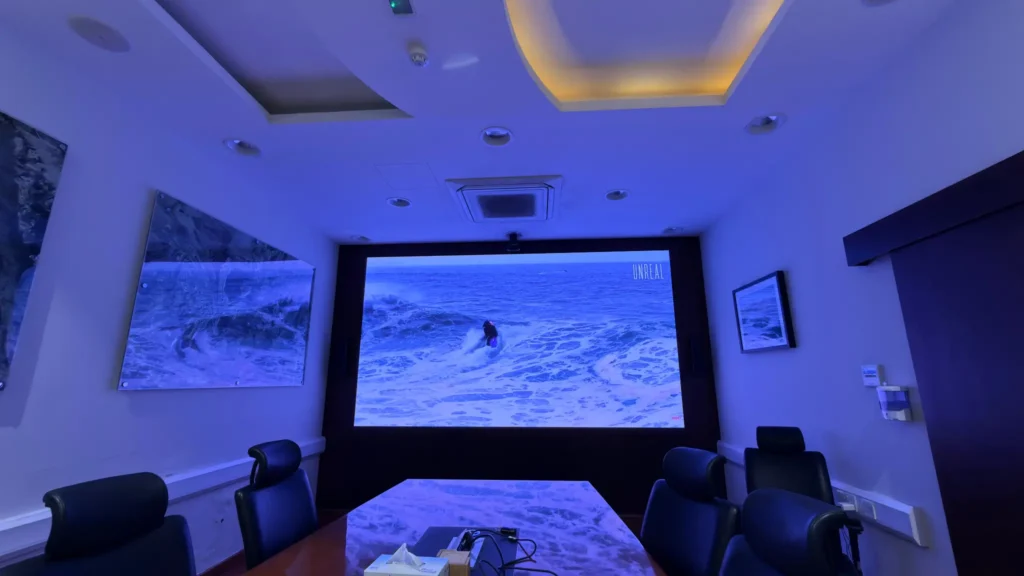 Conference room with wall-mounted LED display screen for meetings