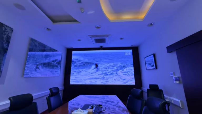 Conference room with wall-mounted LED display screen for meetings