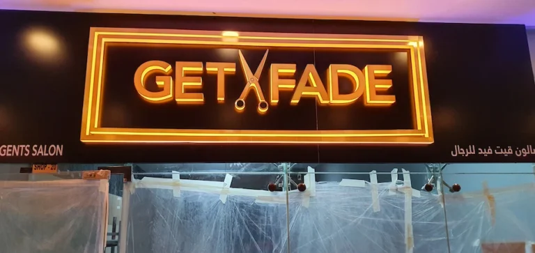 3D neon sign reading 'Get Fade' against dark backdrop