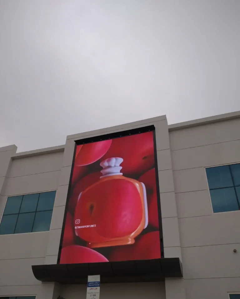 Outdoor LED screen displaying perfume advertisement