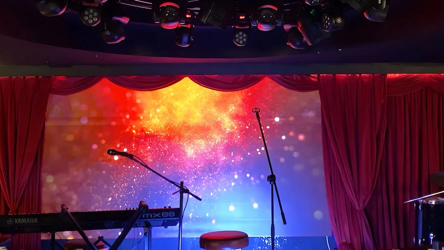 LED stage screen displaying flame design visuals