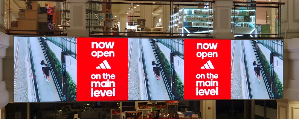 Large mall LED screen displaying city street visual