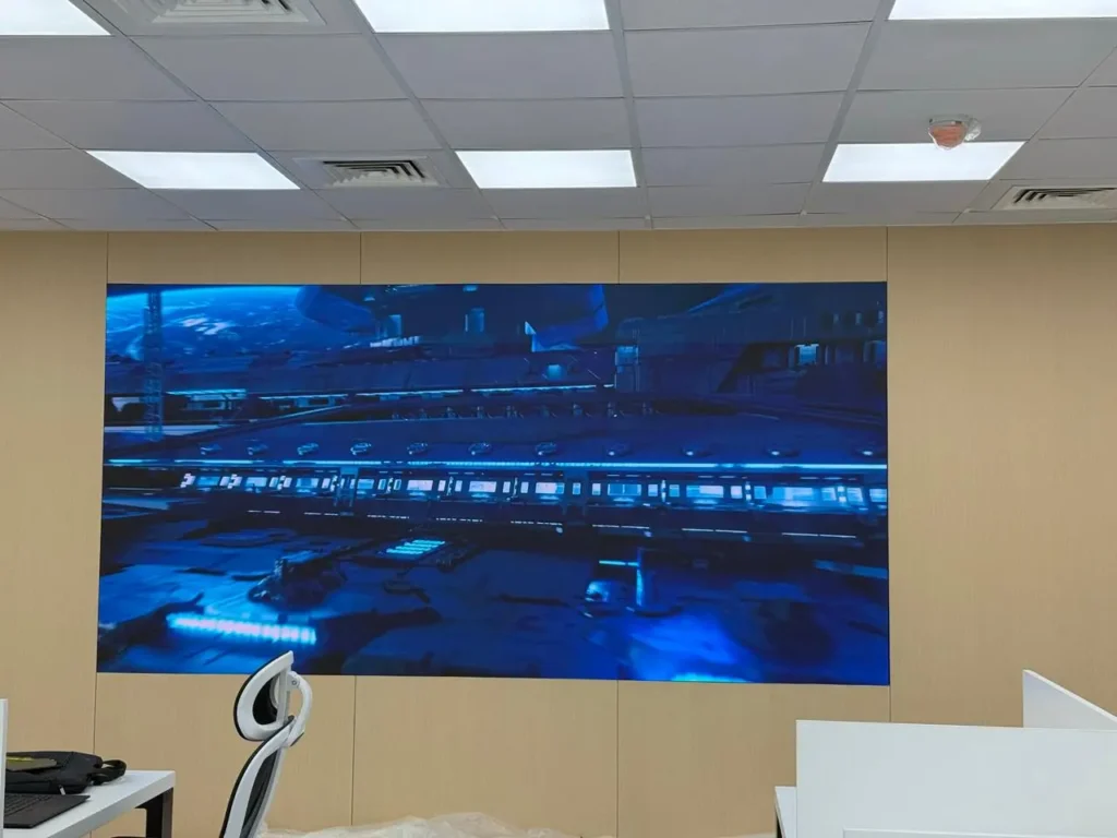 Large P1.53 SMD indoor LED video wall mounted on a wall in a modern office